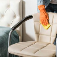 front-view-woman-cleaning-chair